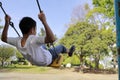 Japanese boy on the swing Royalty Free Stock Photo