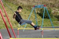 Japanese boy on the swing Royalty Free Stock Photo