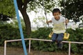 Japanese boy on the swing Royalty Free Stock Photo