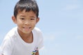 Japanese boy under the blue sky in summer