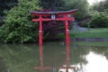 Japanese Brooklyn botanical garden with a small lake and red torii Royalty Free Stock Photo