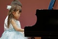 Japanese brother and sister playing piano on stage Royalty Free Stock Photo