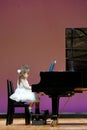 Japanese brother and sister playing piano on stage Royalty Free Stock Photo