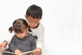 Japanese brother and sister reading a picture book Royalty Free Stock Photo