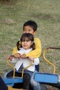 Japanese brother and sister on the seesaw Royalty Free Stock Photo