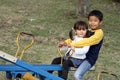 Japanese brother and sister on the seesaw Royalty Free Stock Photo