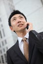 Japanese businessman talks with a mobile phone Royalty Free Stock Photo