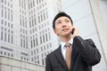 Japanese businessman talks with a mobile phone Royalty Free Stock Photo