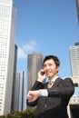 Japanese businessman talks with a mobile phone Royalty Free Stock Photo