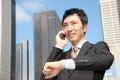 Japanese businessman talks with a mobile phone Royalty Free Stock Photo