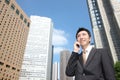 Japanese businessman talks with a mobile phone Royalty Free Stock Photo