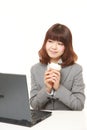 Japanese businesswoman takes a coffee break Royalty Free Stock Photo