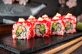 Japanese California Roll with eel, avocado, cucumber, cream with Philadelphia cheese, tobiko caviar and Japanese mayonnaise Royalty Free Stock Photo