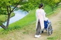 Japanese caregivers and senior in the field Royalty Free Stock Photo