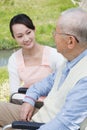 Japanese caregivers and senior speak in the field Royalty Free Stock Photo