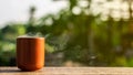 Japanese ceramic tea cup on wooden desk in the morning.