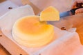 Japanese Cheesecake with seperated slice in opened paper box. Soft and sweet Royalty Free Stock Photo