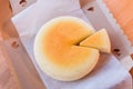 Japanese Cheesecake with seperated slice in opened paper box. Soft and sweet