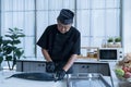 Japanese chef cleaning salmon. A worker cutting salmon on a board Royalty Free Stock Photo