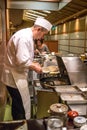 Japanese chef cooking tempura in Kyoto, Japan