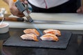 Japanese chef making salmon sushi