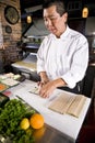 Japanese chef in restaurant making sushi roll Royalty Free Stock Photo