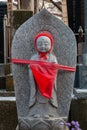 Japanese child grave shrine - the bright red scarf