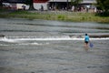 Japanese children fishing fish at Hozugawa River of Arashiyama