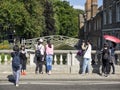 Japanese and Chines tourists photographing Mathematical Bridge