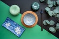 Japanese or Chinese table setting with traditional table mat and dinnerware with green and black background.