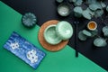 Japanese or Chinese table setting with traditional table mat and dinnerware with green and black background. Royalty Free Stock Photo