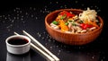 Japanese or Chinese udon noodles with chicken and vegetables, balkar pepper, carrots, parsley, white and black sesame, red onion