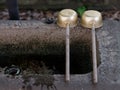 Japanese Chozubachi stone water bowl with two dippers.