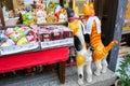 Japanese colorful souvenir shop display with many cute kawaii lucky cats figures and toys.