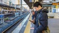 Japanese Commuters on a Platform