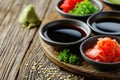 Japanese condiment for sushi. Soy sauce, wasabi, pickled ginger, sesame. Japanese cuisine Royalty Free Stock Photo