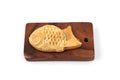 Japanese confectionery Taiyaki fish cake on cutting board on white background Royalty Free Stock Photo