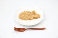 Japanese confectionery Taiyaki fish cake on plate on white background Royalty Free Stock Photo