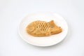 Japanese confectionery Taiyaki fish cake on plate on white background Royalty Free Stock Photo