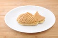 Japanese confectionery taiyaki fish cake wagashi on plate on table Royalty Free Stock Photo