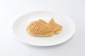 Japanese confectionery taiyaki fish cake wagashi on plate on white background Royalty Free Stock Photo