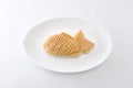 Japanese confectionery taiyaki fish cake wagashi on plate on white background Royalty Free Stock Photo