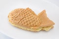 Japanese confectionery taiyaki fish cake wagashi on plate on white background Royalty Free Stock Photo