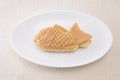 Japanese confectionery taiyaki fish pancake wagashi on plate on table Royalty Free Stock Photo