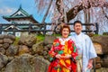 Japanese couple attend a Japanese traditional wedding ceremony at Hirosaki Park Royalty Free Stock Photo