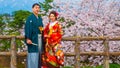 Japanese couple attend a Japanese traditional wedding ceremony at Hirosaki Park Royalty Free Stock Photo