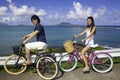 Japanese couple on bikes Royalty Free Stock Photo