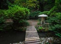 Japanese Crane Stone and Lantern in summer garden Royalty Free Stock Photo