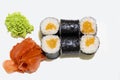 Japanese cuisine food photography maki sushi rolls salmon raw fish rice and noti ingredients with ginjer and wasabi white studio