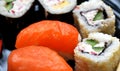 Japanese cuisine, nigiri sushi with salmon and rolls close-up Royalty Free Stock Photo